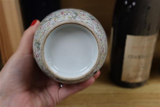 A Chinese famille rose ovoid vase, Qing dynasty, finely painted with flowers and scrolling foliage, H. 15cm, drilled hole to side of ba